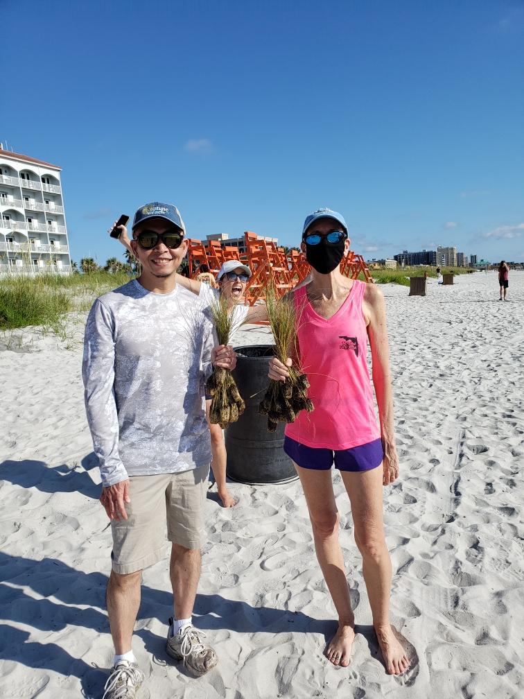 Planting sea oats with Councilor Sandy Golding and Mayor Pro-Tem Chris Hoffmann